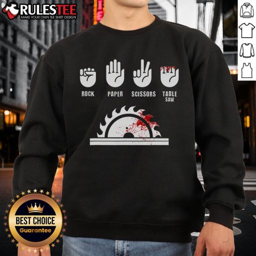 Alt Text: Funny carpenter playing rock-paper-scissors with a table saw on a sweatshirt design, perfect for woodworking enthusiasts.