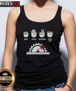 Funny carpenter in a humorous tank top playing rock-paper-scissors with a table saw, showcasing woodworking humor.