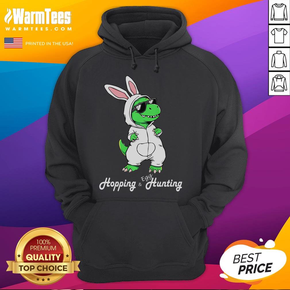 Funny Dino In Cute Easter Bunny Rabbit Costume Dinosaur Hoodie Alt Text: Cute dinosaur in a funny Easter bunny costume, wearing a colorful dinosaur hoodie for a playful spring look.