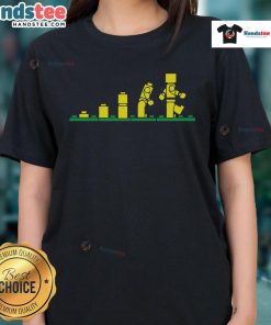 Funny Evolution of Lego Ladies Tee showcasing playful designs of female Lego characters through the ages.