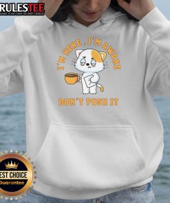 Funny cat in a coffee hoodie with 'I'm Here, I'm Awake, Don't Push' slogan, perfect for coffee lovers and cat enthusiasts.