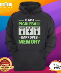 Person wearing a Funny Playing Pickleball Improves Memory hoodie, laughing while playing pickleball on a sunny court.