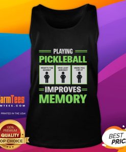 Person wearing a funny pickleball tank top, smiling while playing pickleball to boost memory and brain health.
