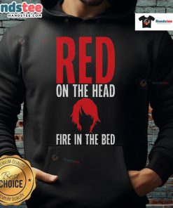Alt Text: Funny redhead wearing a hoodie with 'Fire in the Bed' design, showcasing a playful style and vibrant colors.