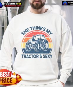 Alt Text: Vintage farmer sweatshirt featuring the phrase Funny, She Thinks My Tractor's Sexy in bold lettering.