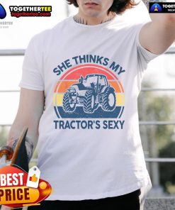 Funny She Thinks My Tractor's Sexy vintage farmer t-shirt design featuring a playful tractor graphic and humorous text.