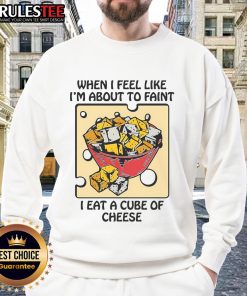 Funny sweatshirt featuring the phrase 'When I feel like I'm about to faint, I eat a cube of cheese' for cheese lovers.