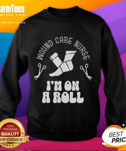 Funny wound care nurse sweatshirt saying 'I'm On A Roll' featuring a playful design for healthcare professionals.