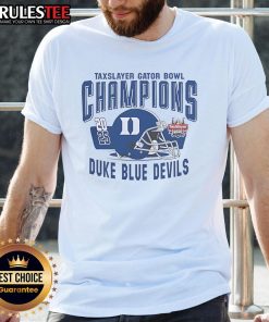 Alt Text: Duke Blue Devils Helmet T-Shirt celebrating the 2025 Gator Bowl Champions, featuring vibrant team colors and logo.
