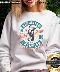 Alt Text: Good Badminton Champion Train Hard 1980 sweatshirt showcasing vintage design and athletic spirit in sportswear.