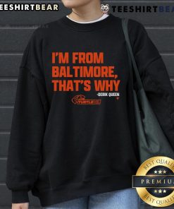 Good Derik Queen I'm From Baltimore orange sweatshirt worn by a model, showcasing stylish streetwear fashion.