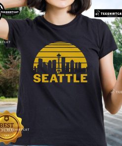 Vintage Seattle cityscape graphic on ladies tee, showcasing iconic skyline and urban charm of Washington.