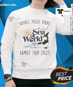 Family wearing 'Good Whale Hello There' sweatshirts at Sea World during 2025 trip, enjoying a fun day by the water.
