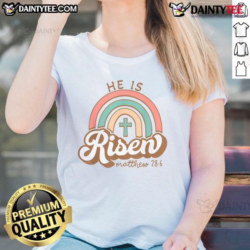 Alt Text: Vintage Easter ladies tee featuring a colorful rainbow cross with the phrase Happy He Is Risen. Perfect for Easter celebrations.