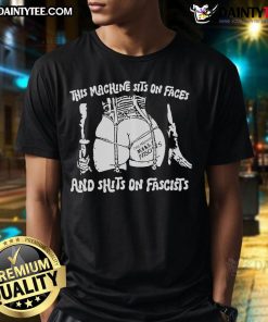 Alt Text: Hot This Machine Sits On Faces And Shits On Fascists T-Shirt design featuring bold text and vibrant colors.