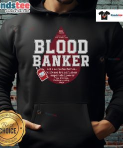 Lab scientist wearing a Nice Blood Bank hoodie in a medical lab during Lab Week, showcasing lab technology.