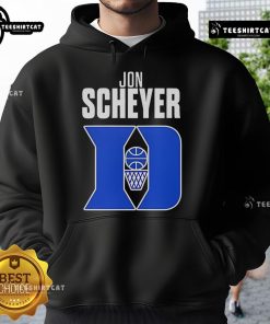 Alt Text: Jon Scheyer, Duke Blue Devils basketball coach, wearing a hoodie, celebrates Coach of the Year award victory.