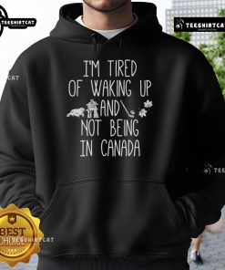 Cozy hoodie featuring 'I'm Tired of Waking Up and Not Being in Canada' design, perfect for expressing Canadian love.