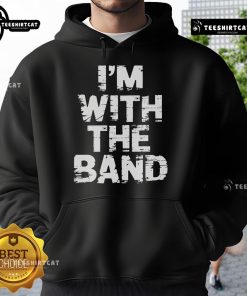 Musician in a concert wearing a 'Nice, I'm With The Band' hoodie, capturing the vibrant energy of live music.