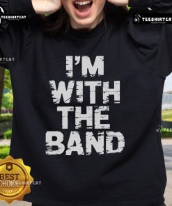 Person wearing a 'Nice, I'm With The Band' sweatshirt at a lively concert, enjoying the music and atmosphere.