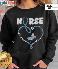 Cozy Nice Los Angeles Dodgers nurse sweatshirt, featuring 'It's a Work of Heart' slogan, perfect for fans and healthcare workers.