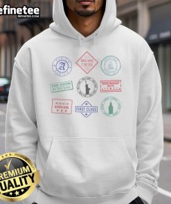 Cozy travel hoodie featuring colorful passport stamps, perfect for adventure lovers and globe-trotters.