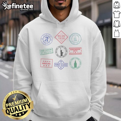 Cozy travel hoodie featuring colorful passport stamps, perfect for adventure lovers and globe-trotters.