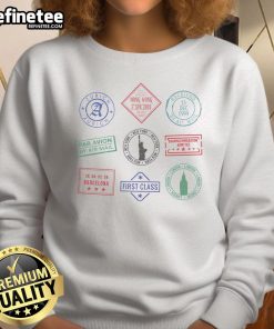 Cozy sweatshirt featuring vibrant passport stamps, perfect for travel enthusiasts and those who love adventure.