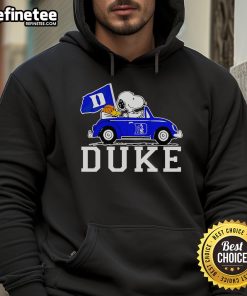 Alt Text: Snoopy and Woodstock driving in a Duke Blue Devils basketball hoodie, showcasing team spirit and fun style.