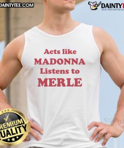 Official Acts Like Madonna wearing a Merle tank top, showcasing a stylish look in a vibrant urban setting.