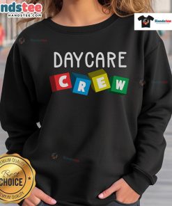 Alt Text: Official Daycare Crew sweatshirt worn by a childcare provider, showcasing a cozy and professional look for caregivers.
