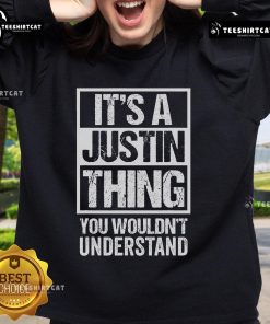 Cozy Official 'It's A Justin Thing You Wouldn't Understand' sweatshirt displayed on a hanger, perfect for fans.