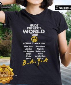 Official Nude Project World Tour ladies tee design featuring vibrant graphics, perfect for fans and concert-goers.