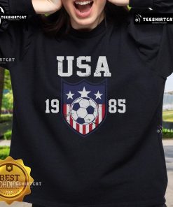 Alt Text: Vintage Official USA Soccer Team 1985 sweatshirt featuring classic logo and retro design in navy blue.