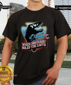 Official When Dinosaurs Ruled The Earth T-Shirt featuring vibrant dinosaur graphics and classic movie-inspired design.