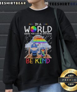 Pretty Charlie Brown and Snoopy New York Knicks sweatshirt with 'In a world where you can be anything, be kind' slogan.
