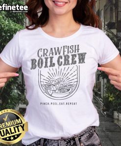Cheerful women in 'Pinch, Peel, Eat, Repeat' tees enjoying a crawfish boil, showcasing camaraderie and Southern culture.