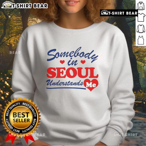 Stylish Pretty Somebody in Seoul Understands Me sweatshirt worn in a vibrant urban setting, showcasing trendy street fashion.