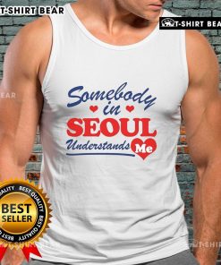 Stylish woman wearing a 'Pretty Somebody In Seoul Understands Me' tank top, enjoying the vibrant streets of Seoul.