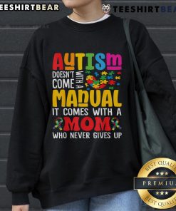 Mom wearing a comfy sweatshirt that reads 'Top Autism Mom Life Doesn't Come With a Manual' for Autism Awareness.