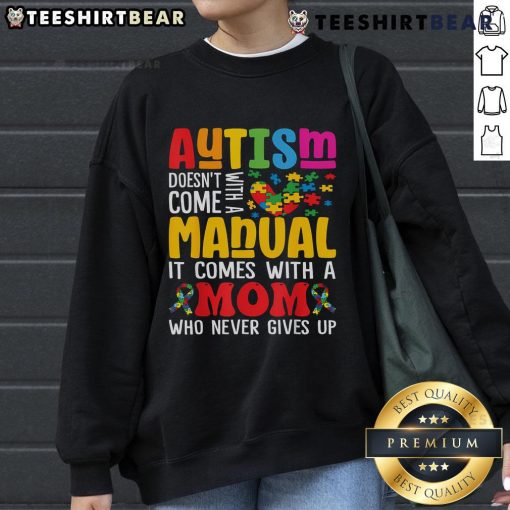 Mom wearing a comfy sweatshirt that reads 'Top Autism Mom Life Doesn't Come With a Manual' for Autism Awareness.