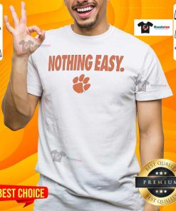 Alt Text: Top Clemson Tigers Nothing Easy T-Shirt featuring bold team logo and vibrant colors, perfect for fans.