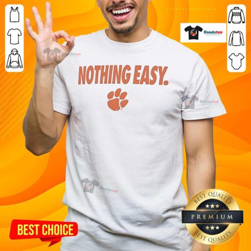 Alt Text: Top Clemson Tigers Nothing Easy T-Shirt featuring bold team logo and vibrant colors, perfect for fans.