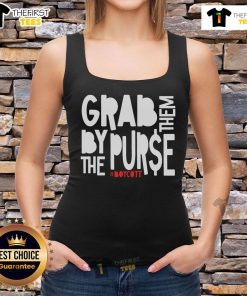Protestor wearing a 'Grab Them By The Purse' tank top at an anti-capitalism rally, showcasing resistance to oligarchy.