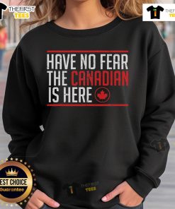 Funny 'No Fear The Canadian Is Here' sweatshirt featuring a vibrant maple leaf design, perfect for proud Canadians.