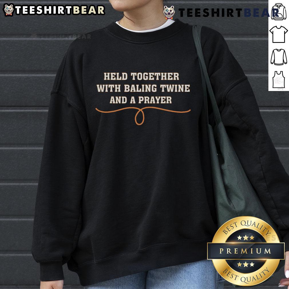 Top Held Together With Baling Twine And A Prayer Sweatshirt Cozy sweatshirt featuring the phrase 'Top Held Together With Baling Twine And A Prayer' for rustic fashion lovers.