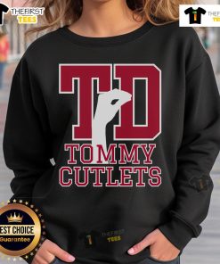 Top NY Italian hand gesture on Tommy Cutlets football sweatshirt, showcasing unique style and cultural flair.
