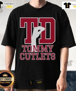 Alt Text: Top NY Italian hand gesture on Tommy Cutlets football t-shirt, showcasing trendy sports apparel with cultural flair.