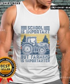 Farmer in a tank top with 'Farming Is Importanter' slogan, posing next to a tractor on a sunny farm day.
