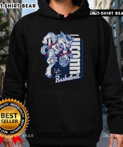 UConn Huskies basketball mascot performs a dunk wearing a stylish hoodie, showcasing school spirit and athletic energy.